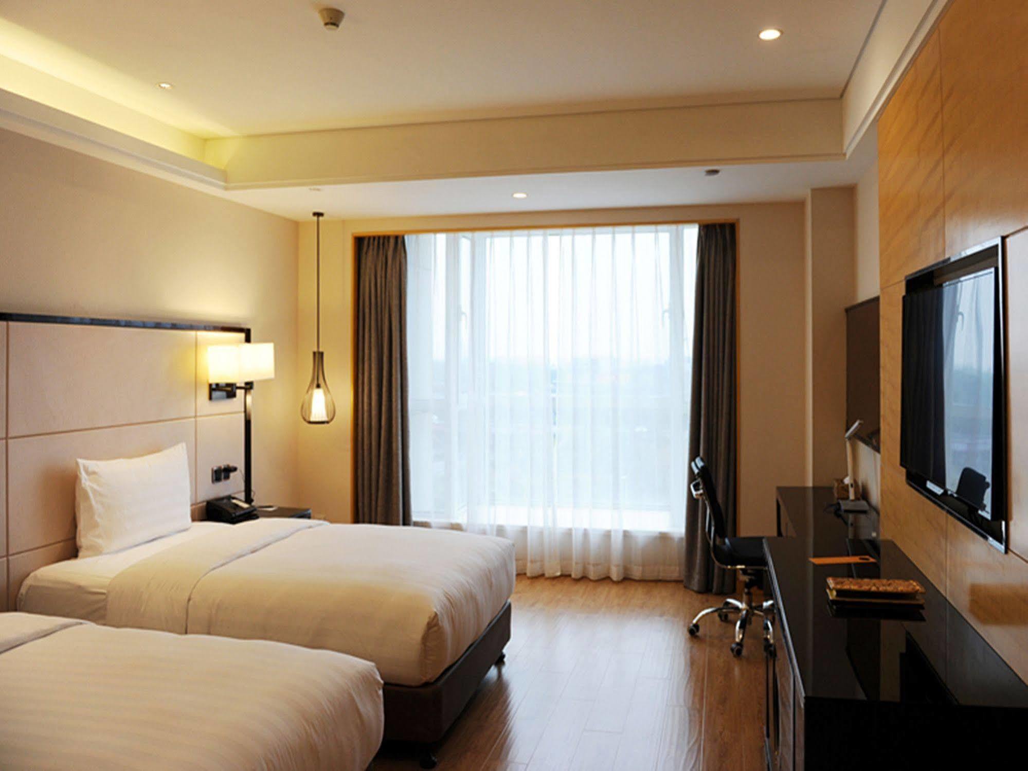 Pullman Qingdao Ziyue Hotel Eksteriør billede